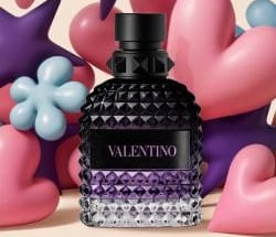 trois flacons de parfum pour homme Valentino Uomo Born in Roma sur fond rayé